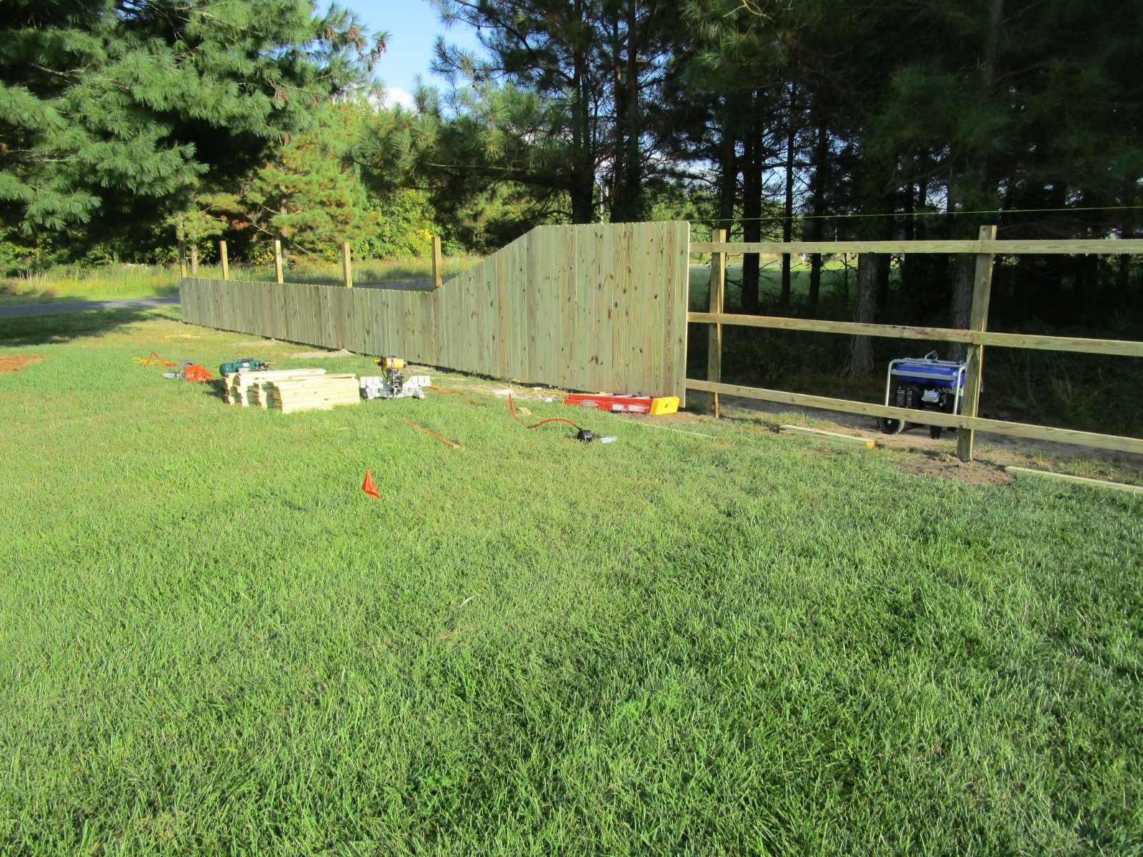 121_fence-in-progress-with-slope Wood - Forrest Fencing